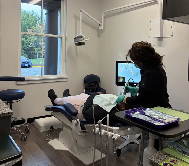 A 703 Dental clinician taking a digital scan of a patient's teeth in Woodbridge, VA