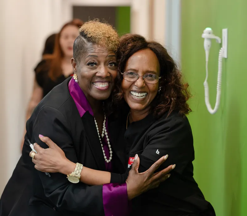 A 703 Dental team member welcoming a guest at the Woodbridge, VA office