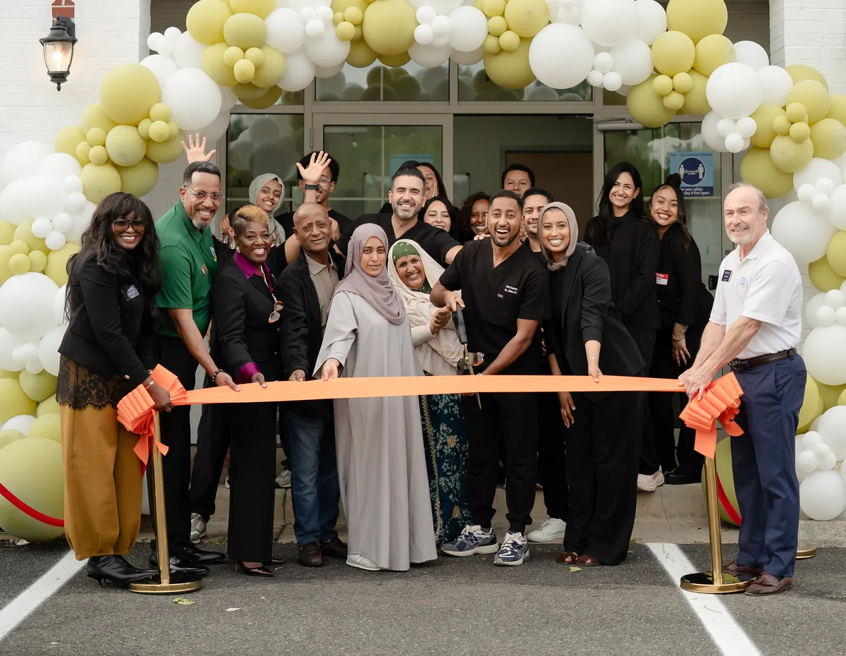 Dr. Bilal Ali and the 703 Dental team at the ribbon cutting for the Woodbridge, VA office