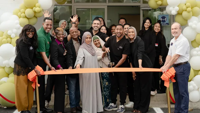 Dr. Bilal Ali and the 703 Dental team at the ribbon cutting for the Woodbridge, VA office