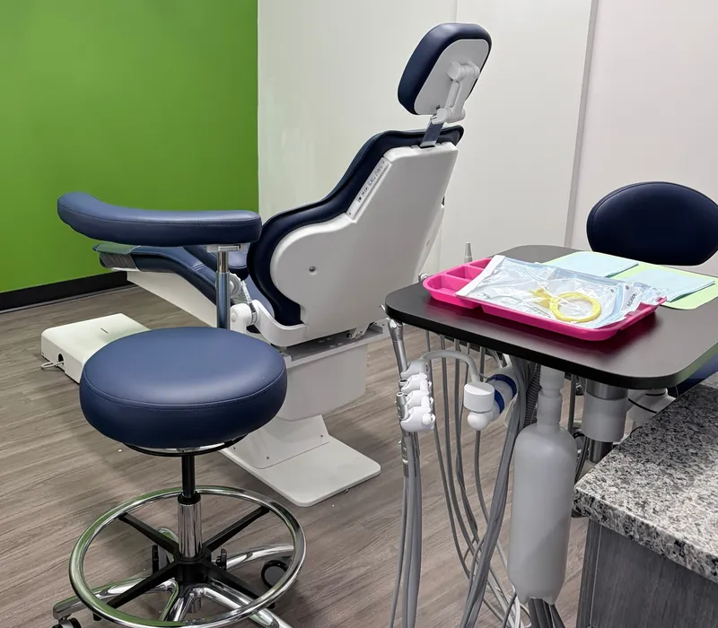A treatment room with a dental chair at 703 Dental in Woodbridge, VA
